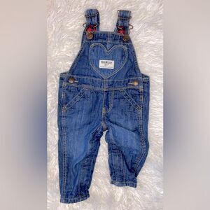 Cotton lined denim baby overalls.